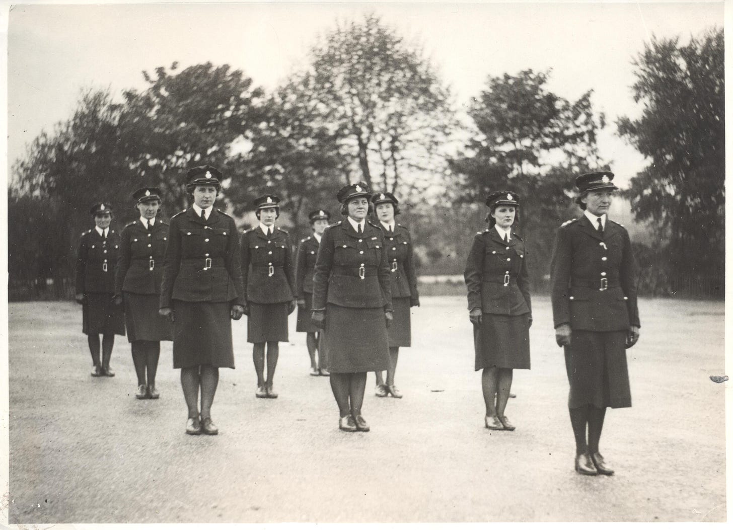 A group of female auxiliary officers standing in rows while parading at HQ