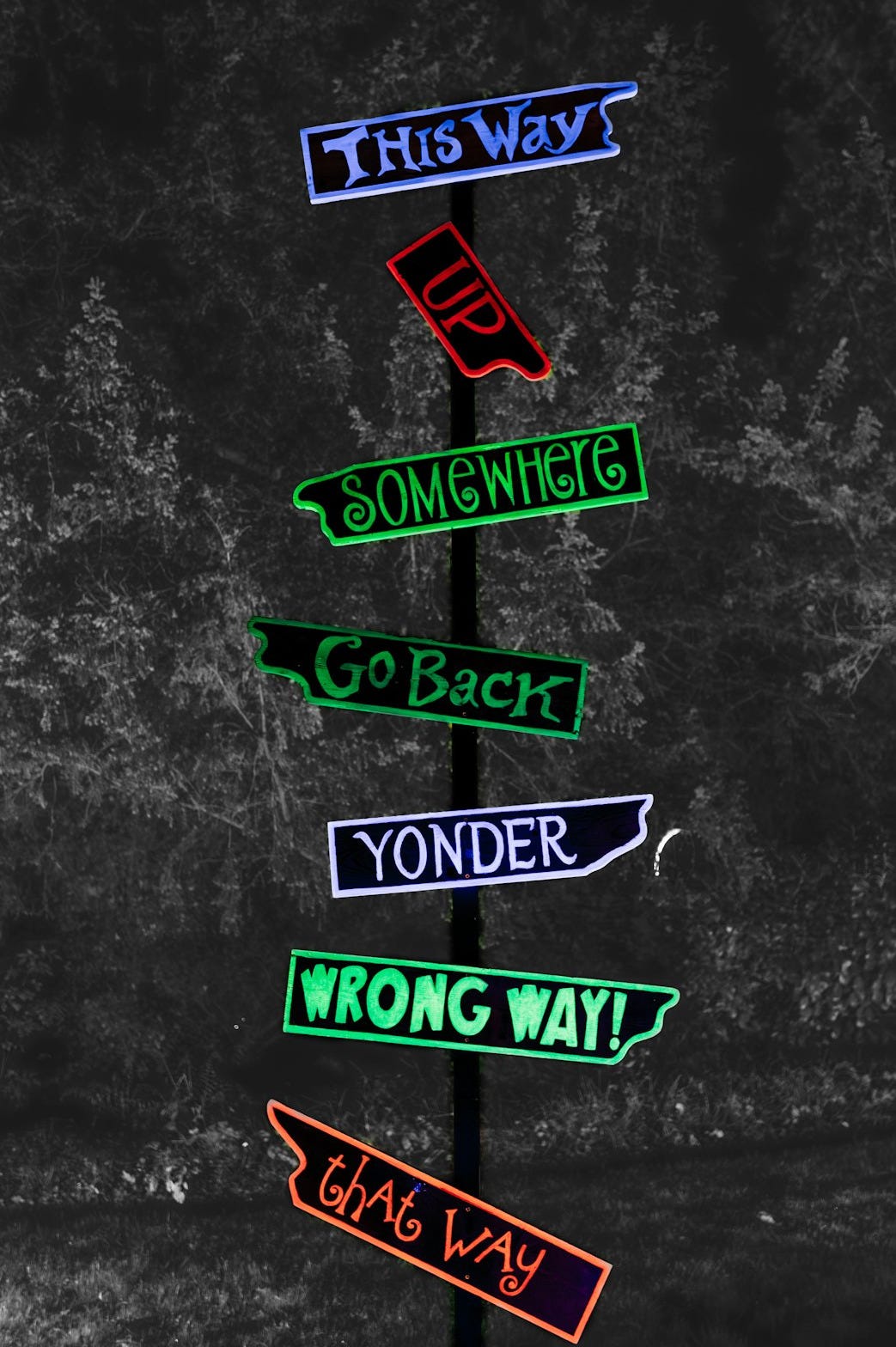 A pole with a bunch of street signs on it