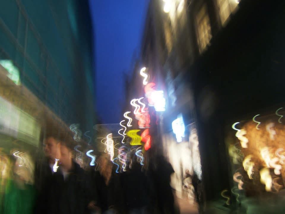 This photograph was taken on a narrow street in Amsterdam, the Netherlands. It happened by chance that the light created some sort of distortion in the camera. I imagine that this image is like our distorted view of reality. It's an approximation of reality, a useful one, but not necessarily a faithful representation. The photograph was taken by Erin Kenny.