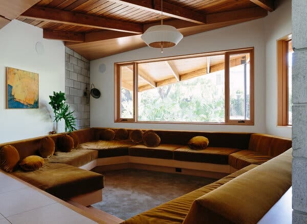 A sunken conversation pit was added where there was previously a carport.