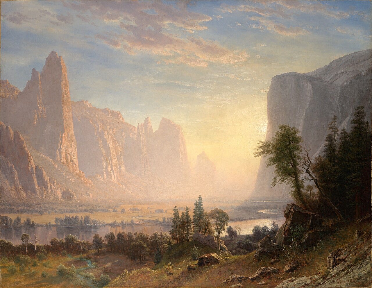 A golden Yosemite valley at sunset with cliffs, a still river and distant falls A golden Yosemite valley at sunset with cliffs, a still river and distant falls