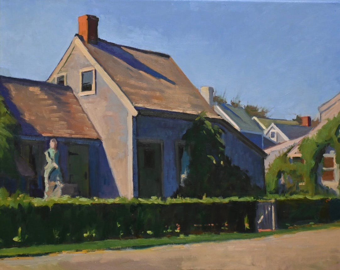 A house with a statue in front of it

Description automatically generated