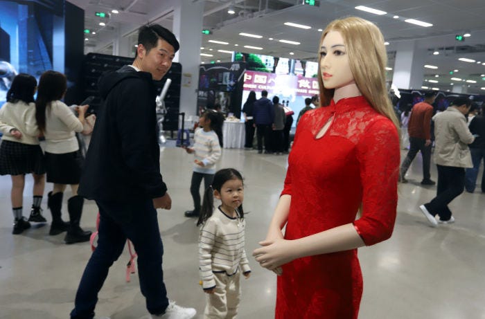 Visitors at an AI robot exhibition in Suzhou, China.