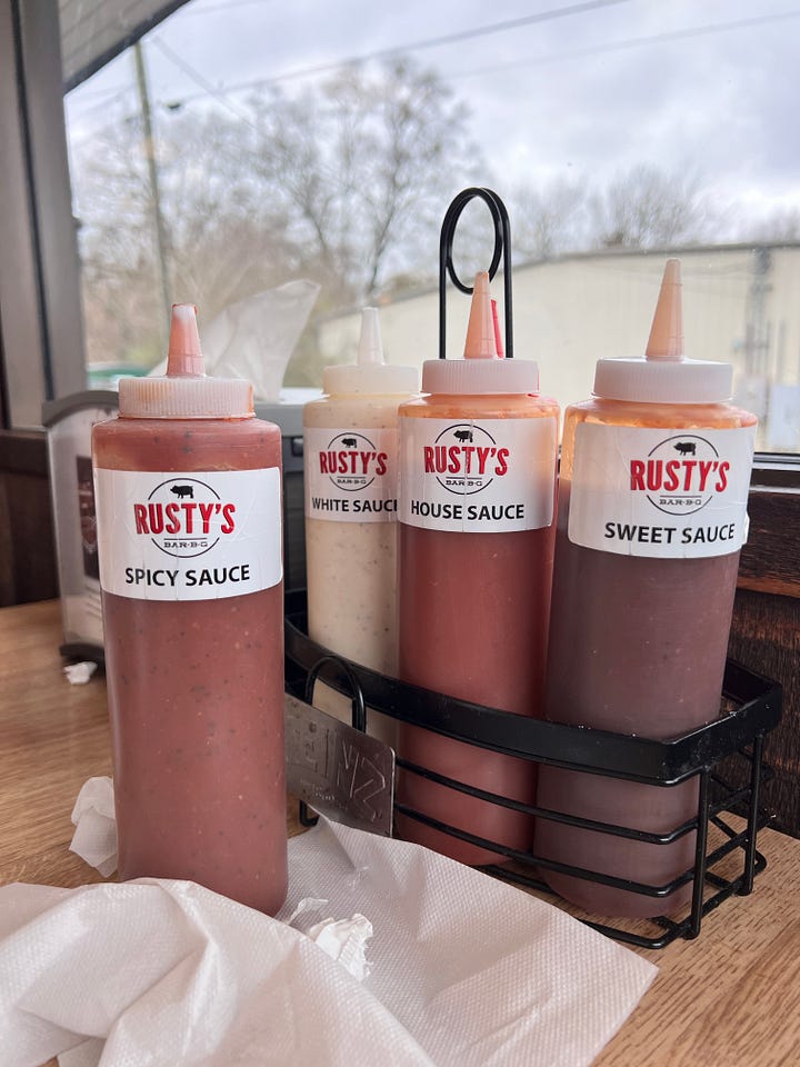 Barbecue sauces in bottles and on serving paper