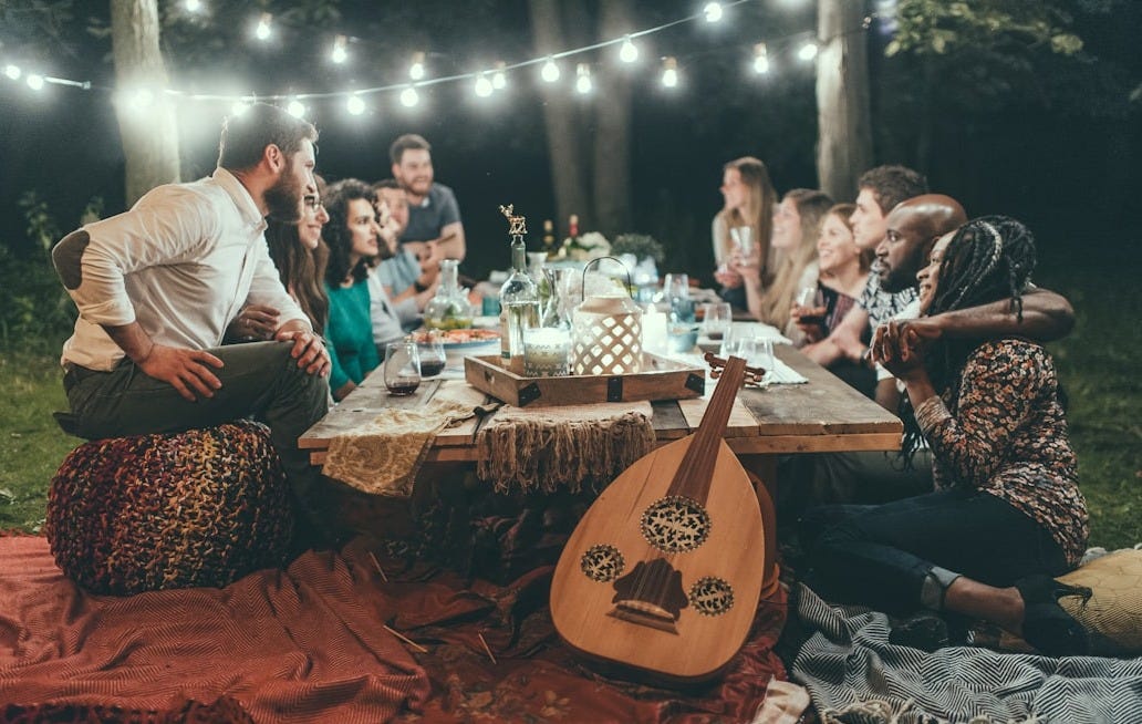people sitting on chair in front of table with candles and candles people sitting on chair in front of table with candles and candles
