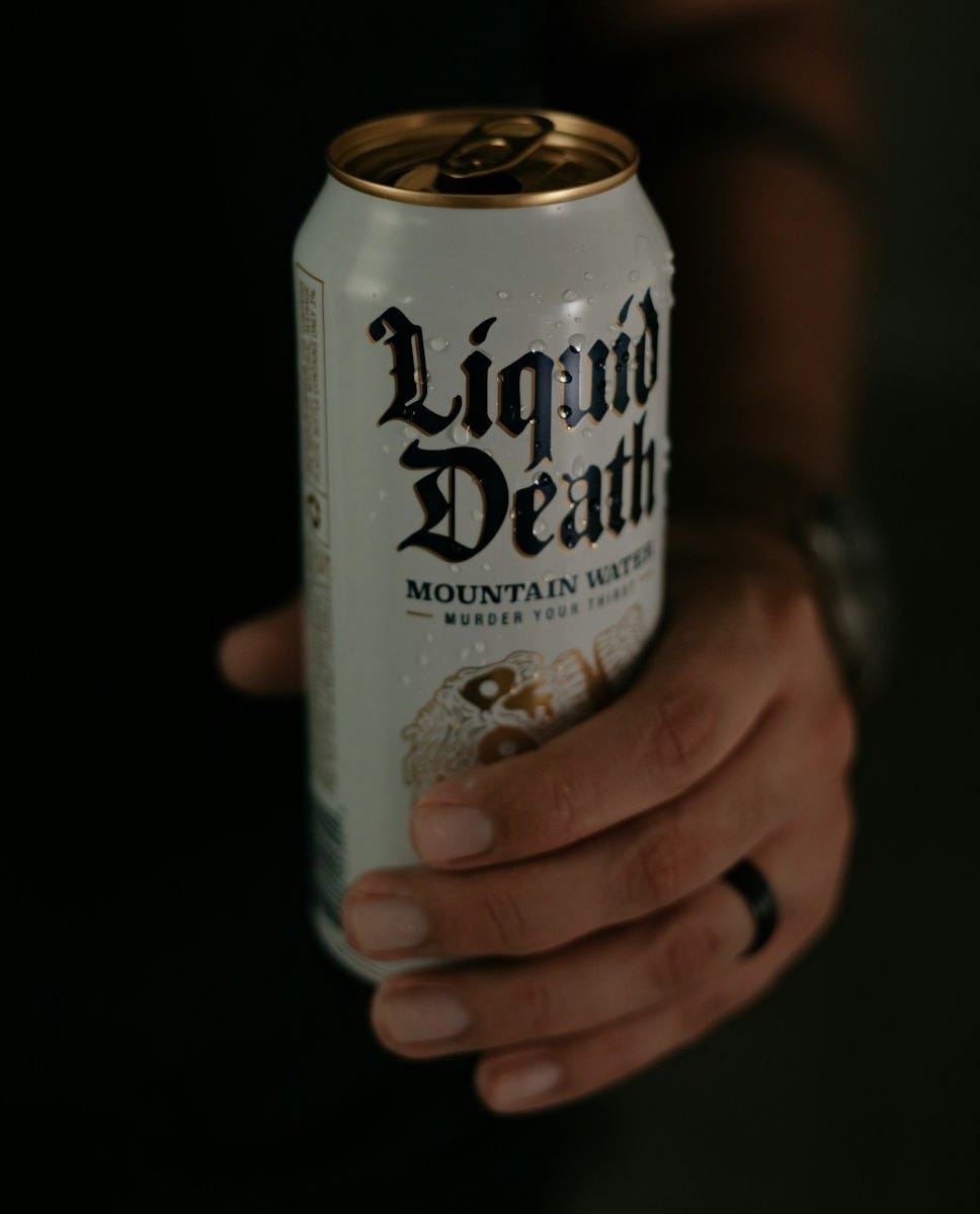 person holding white and brown can person holding white and brown can