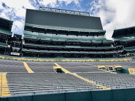 sign, stadium, sky, person