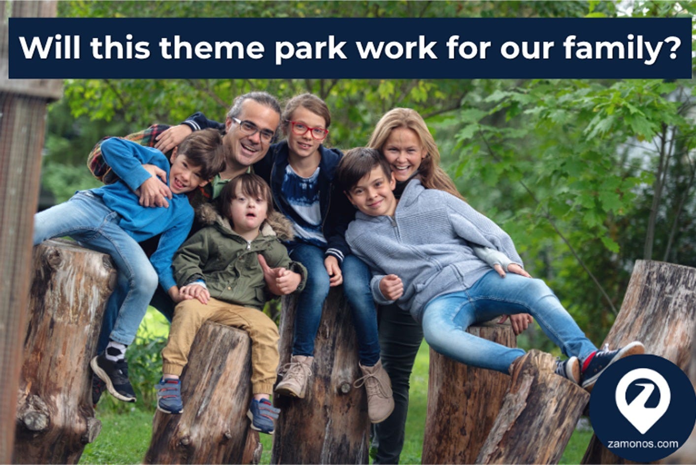 A family of five — two parents and three children, including a young child with Down Syndrome and an older child wearing red glasses — sit together on tree stumps in an outdoor wooded setting, all smiling at the camera. Text overlay reads: "Will this theme park work for our family?" Zamonos logo in the lower right. A family of five — two parents and three children, including a young child with Down Syndrome and an older child wearing red glasses — sit together on tree stumps in an outdoor wooded setting, all smiling at the camera. Text overlay reads: "Will this theme park work for our family?" Zamonos logo in the lower right.