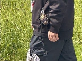 It's unknown if it was real or not, but many in the Walk With Israel saw what appeared to be a hand grenade on a pro-Hamas supporter.
