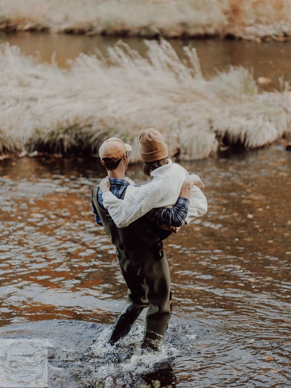 man carrying a woman through water janecurryweber.com