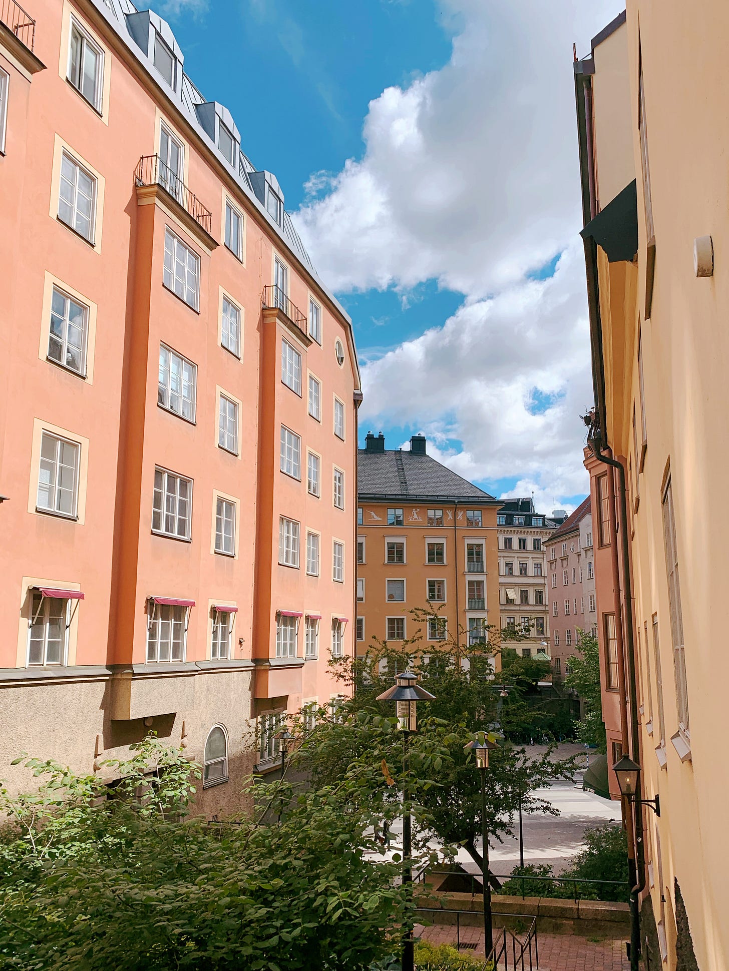 Small pedestrian-only street between two building, wit a stairway