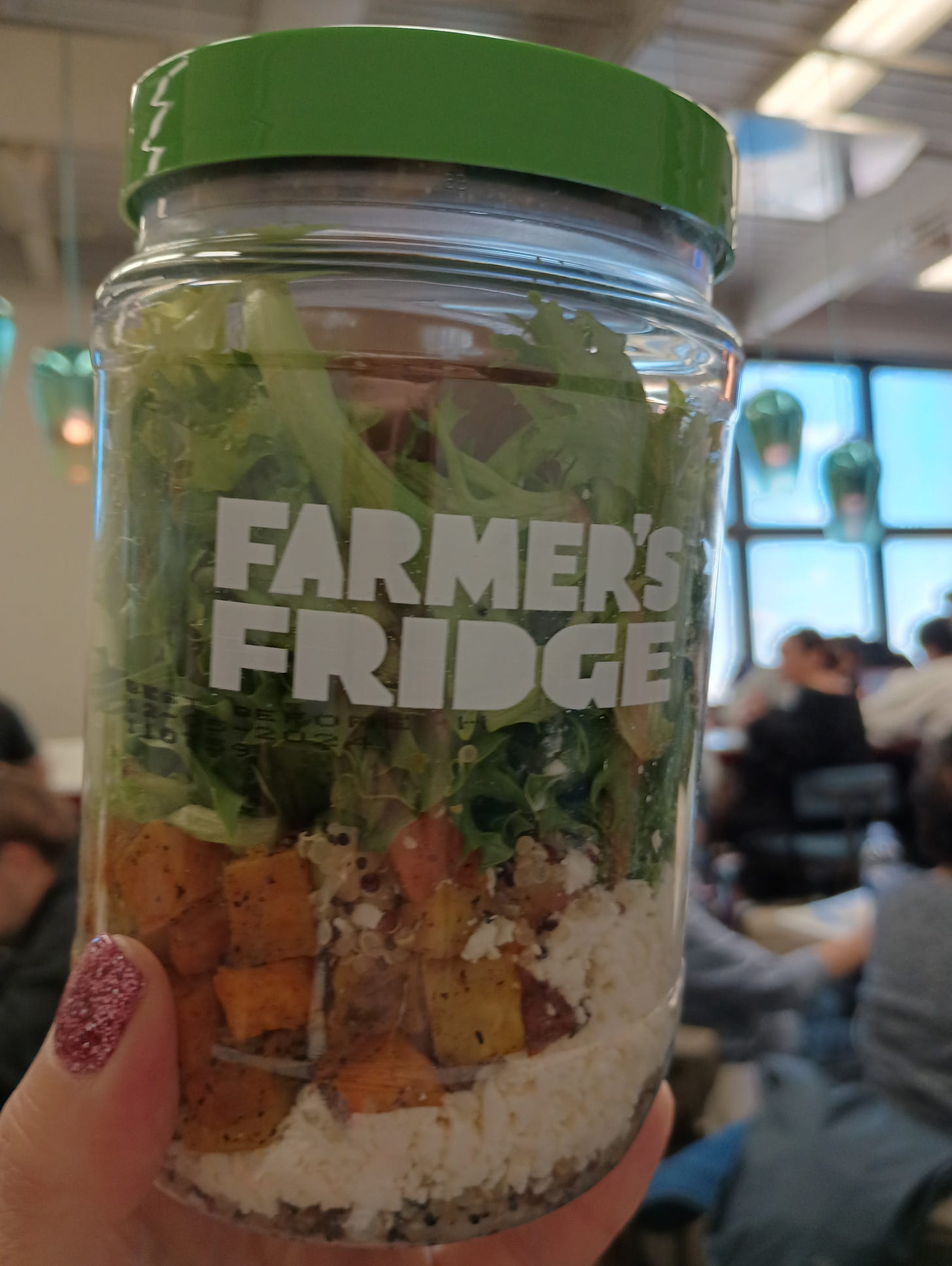 jar marked farmer's fridge containing layered salad.