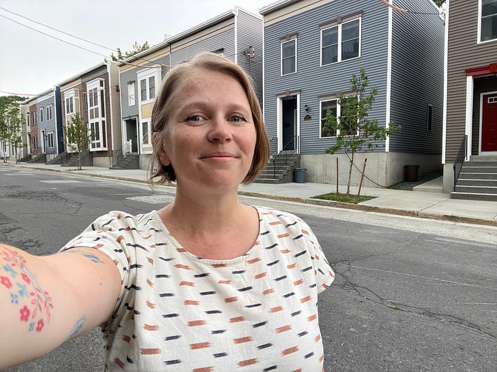 Selfie of Christine in front of the new Habitat houses; photo of Christine with state senator, U.S. congressman and an ice cream truck on Orange St.