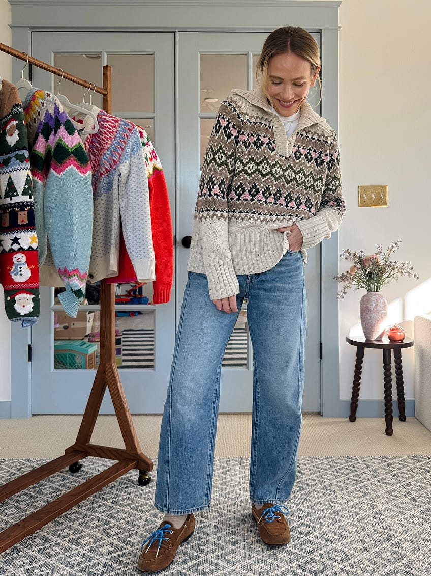 Straight-leg jeans with burgundy holiday sweater