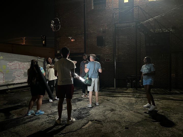 Mark and crew on various film sets.