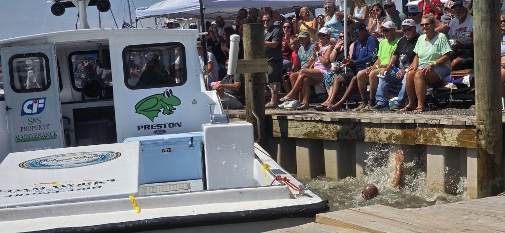 Jake Jacobs lands in the water after jumping from Outlaw during the boat-docking contest.