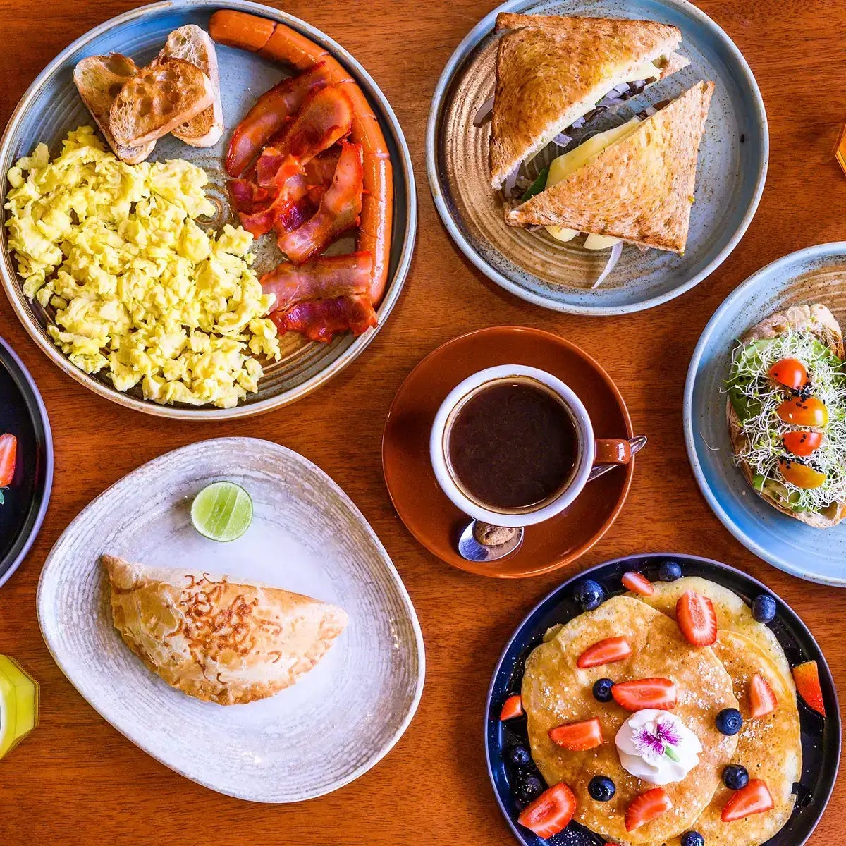 Breakfast spread with coffee and various dishes. Breakfast spread with coffee and various dishes.