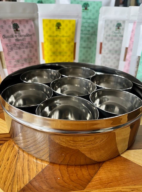Four images of a stainless steel masala tin with seven spices suitable for Indian dishes and curries.