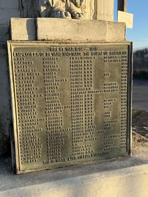 A concrete sphnix and two views of a war memorial