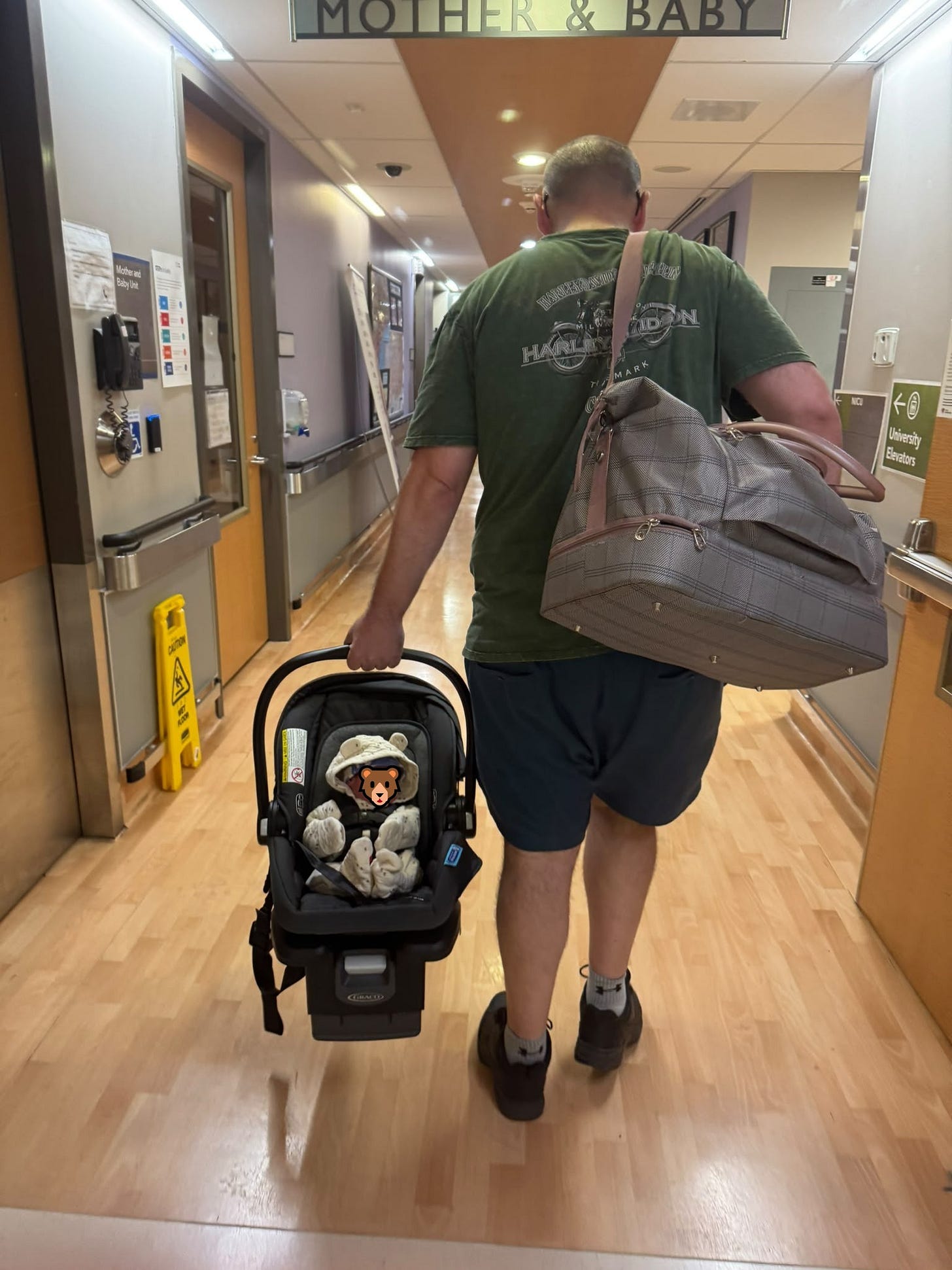 George and his son walking out of the hospital George and his son walking out of the hospital