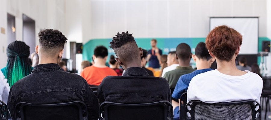 People watching a panel discussion