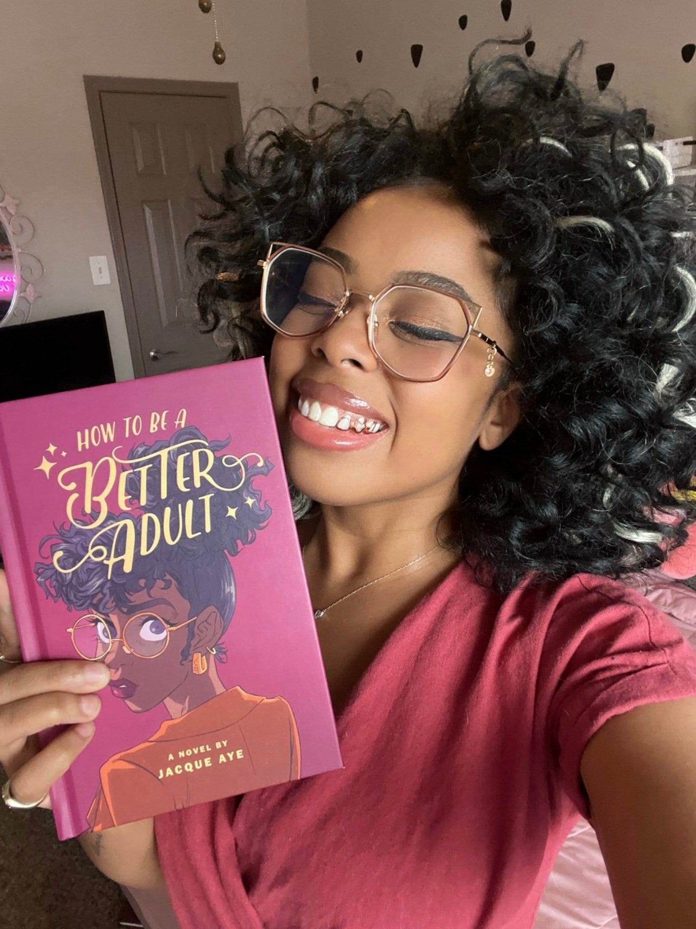 Jacque Aye with her novel How to be a Better Adult Jacque Aye with her novel How to be a Better Adult