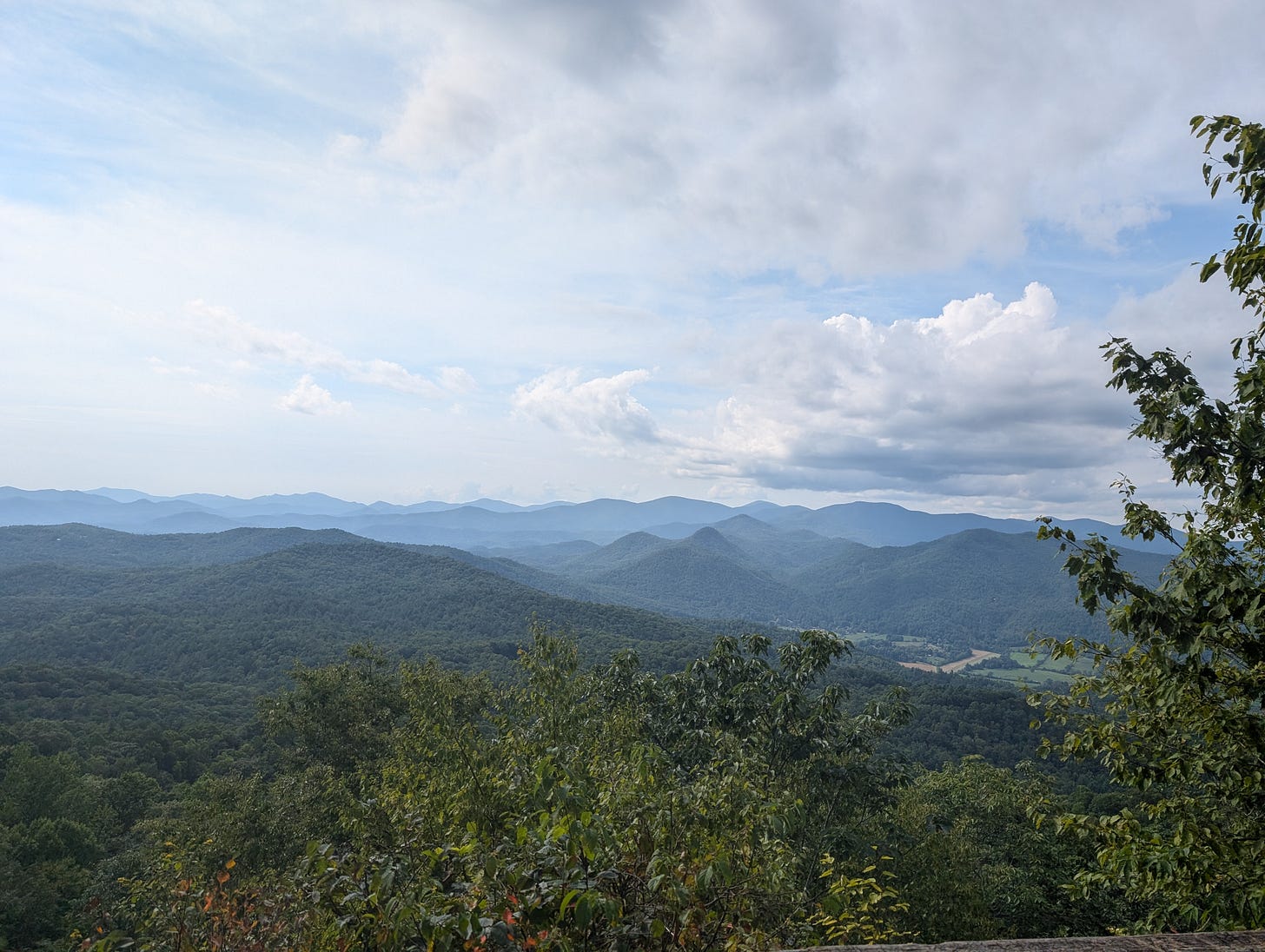A view of blue mountains and blue sky