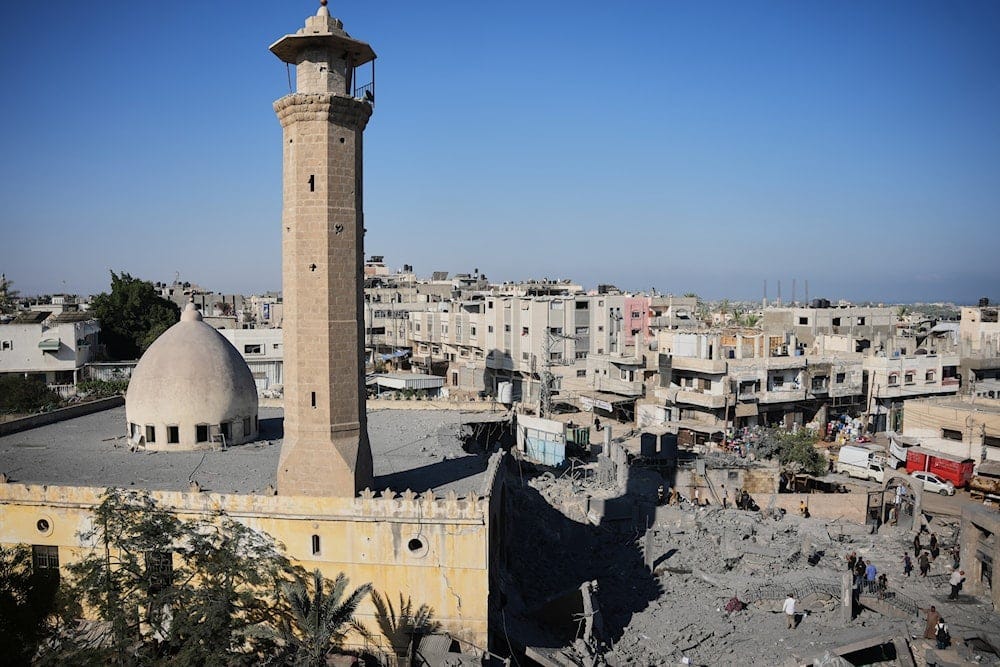 Palestinians inspect the Abu Salim Mosque a day after it was hit by an Israeli airstrike, in Deir al-Balah, central Gaza Strip, Tuesday, Aug. 25, 2026 (AP)