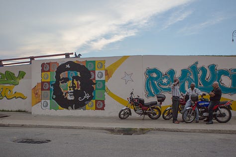 A second 3x3 grid of nine photographs from Havana, Cuba. The images show daily city life, including: kids jumping off the Malecón sea wall, people fishing at sunset, boys playing soccer in the street, classic American cars, a mural of Che Guevara, a dilapidated building, and a street vendor with a fruit cart.