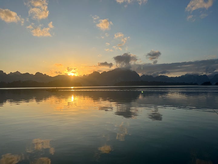 Landscape pics of turquoise water, and a lake reflecting a sunrise.