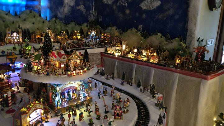 Two photos of the Christmas diorama that we used to put up in our living room