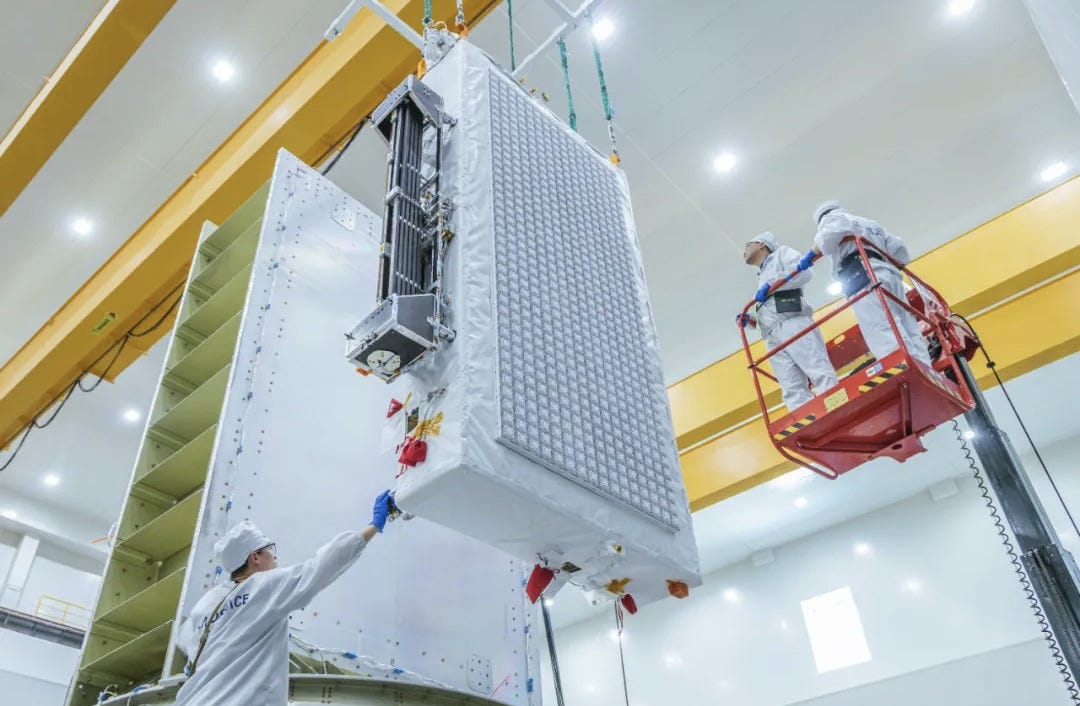 Technicians working to place ‘Qianfan Direct-To-Cell-01 Satellite’ onto a payload adapter ahead of integration with Zhuque-2E.