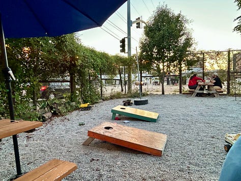 BLT, beer, cornhole, umbrellas, picnic tables
