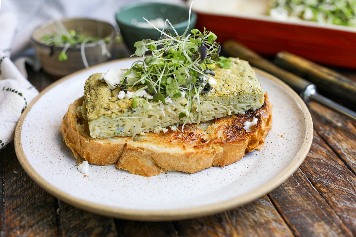 pesto baked eggs over sourdough toast.