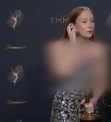 Einbinder in a sparkly silver dress post-Emmy acceptance