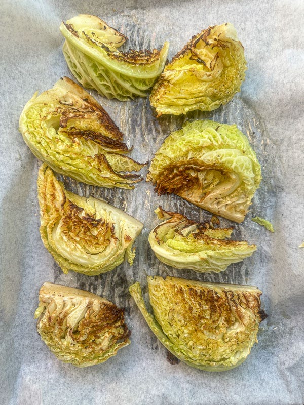 Try this Maple Bacon Cabbage recipe! Roasted cabbage wedges with crispy bacon and a homemade maple Dijon dressing. Easy, flavorful, gluten-free side dish for fall dinners, Thanksgiving, or meal prep. #vegetableside #cabbagerecipes #shutterbean