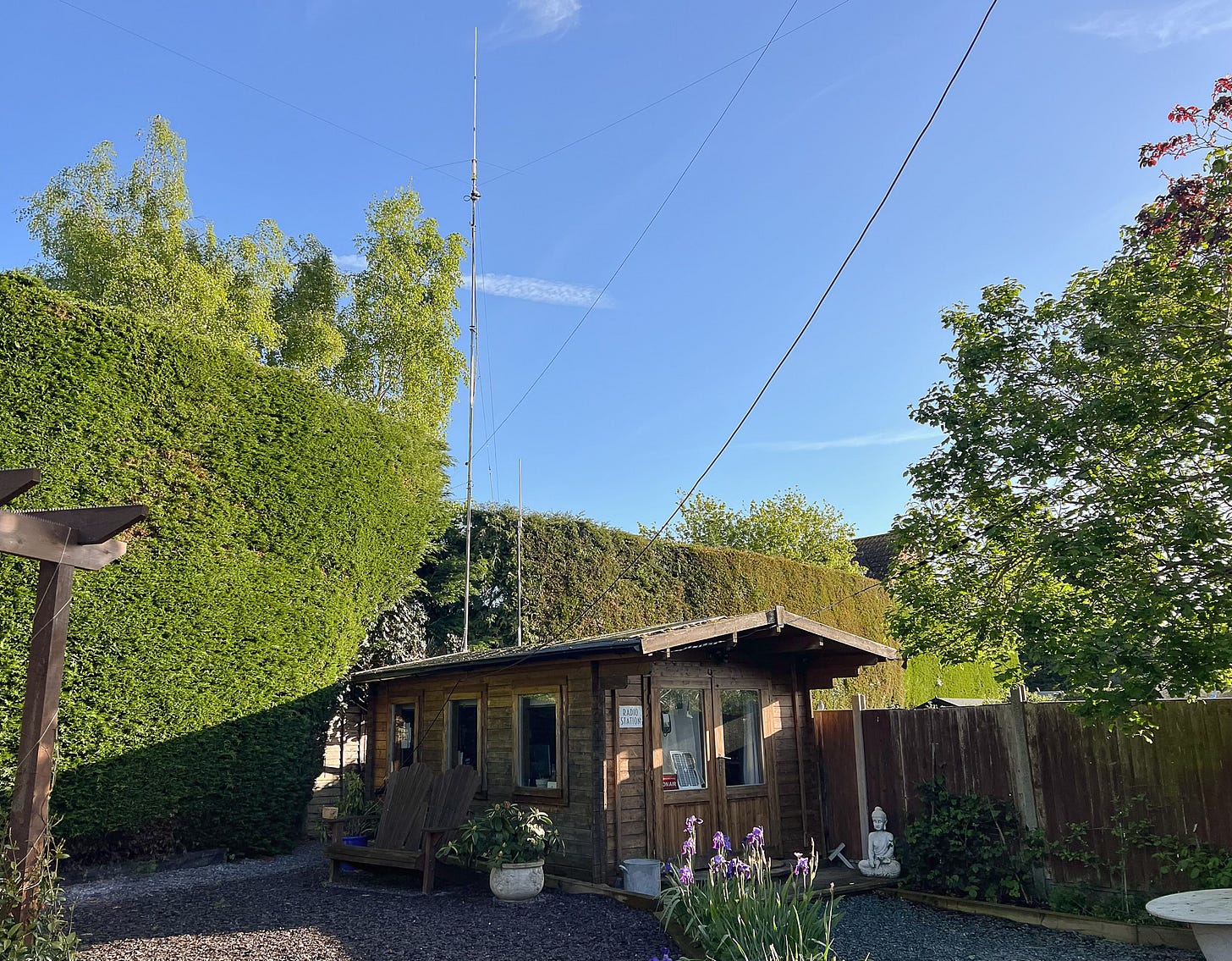 A photo of my shack with antennas glistening in the sun