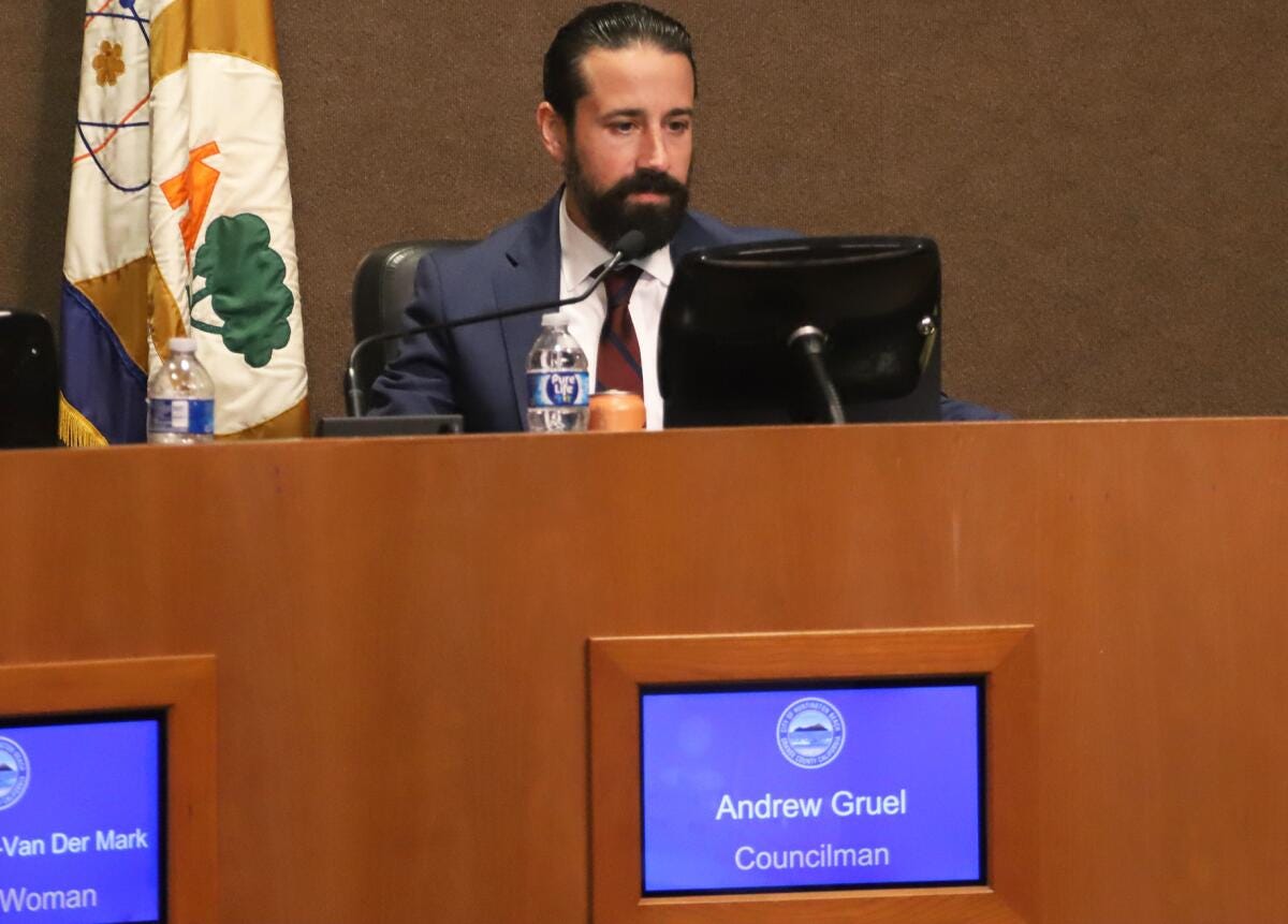 Andrew Gruel sits at his seat after being sworn in as a new Huntington Beach City Council member Tuesday night.