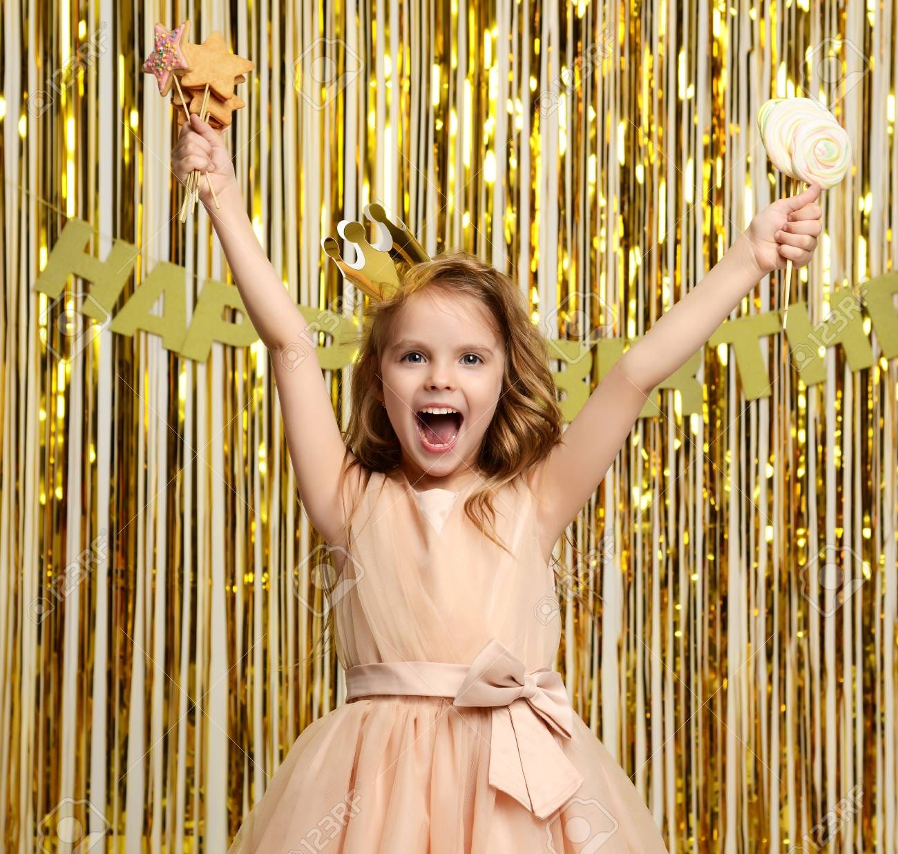 Young Small Girl Kid Ginger Candies Lollipop On Birthday Party Happy  Smiling On Gold Background Stock Photo, Picture and Royalty Free Image.  Image 86230758.