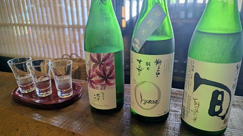 Japanese-style rooms, bowls of food, and bottles of sake.