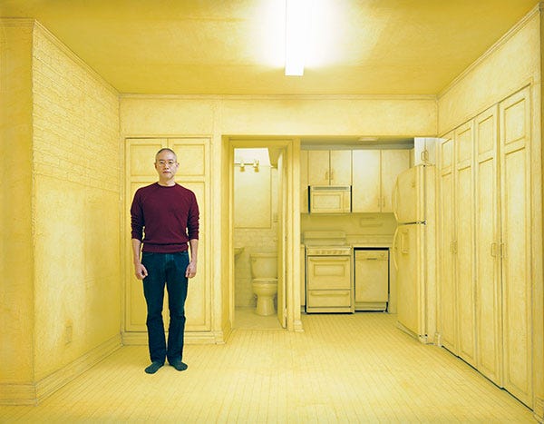 Do Ho Suh at the New York apartment he has lived in for 20 years; every surface is covered in paper as part of his work 'Rubbing/Loving Project: 348 West 22nd Street, New York, NY 10011 (Unit 2)' (2015-2016)
