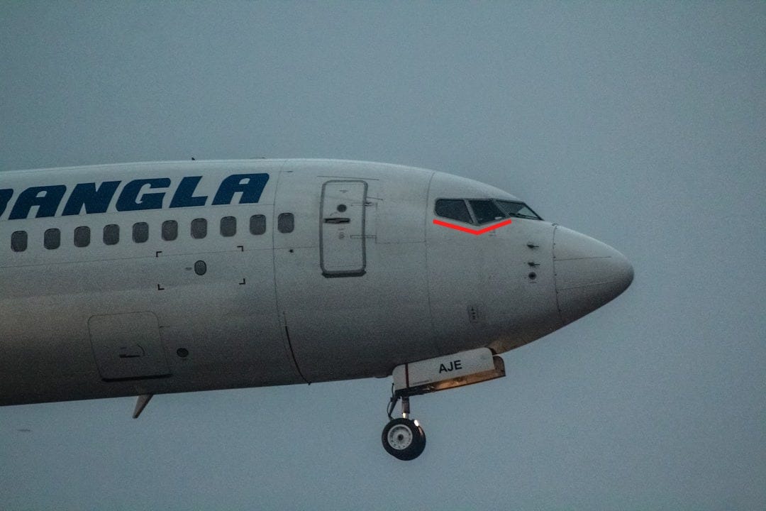 a large passenger jet flying through a cloudy sky a large passenger jet flying through a cloudy sky