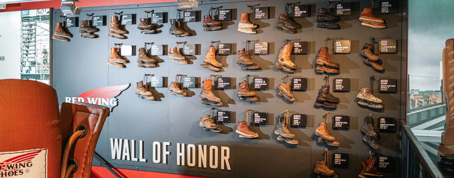 The Wall of Honor with all the honoree's boots hanging on the wall with their plaques next to them The Wall of Honor with all the honoree's boots hanging on the wall with their plaques next to them