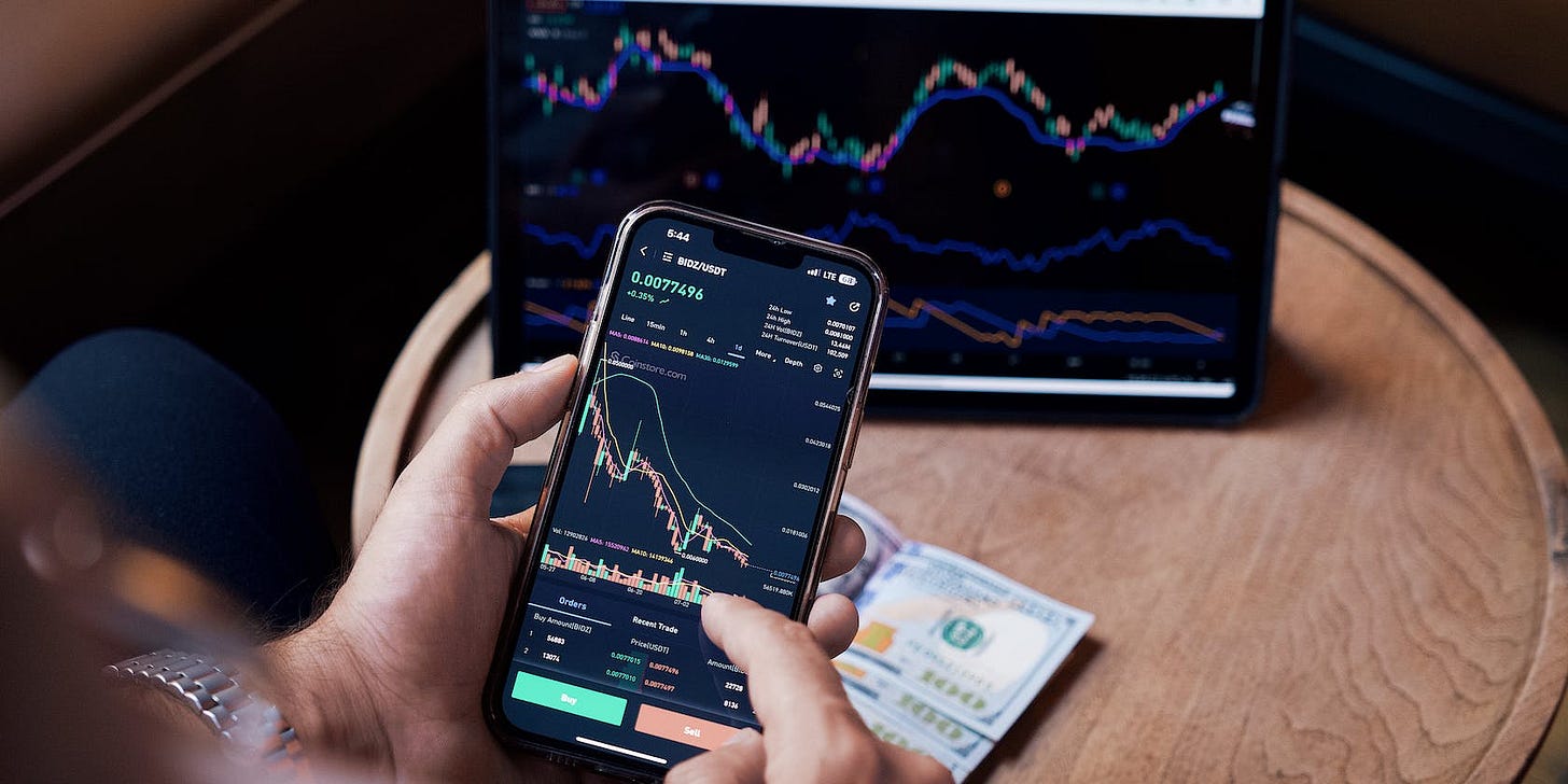 Person looking at stock market on mobile phone