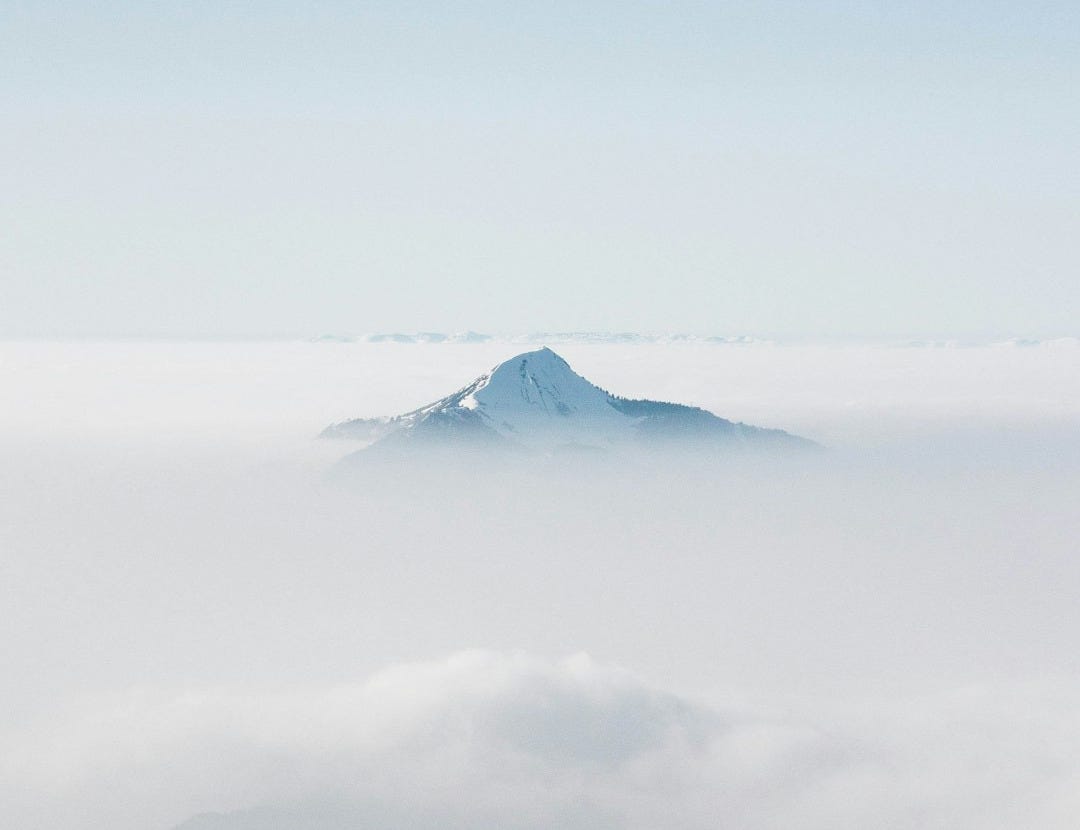 snow covered mountain under blue sky during daytime snow covered mountain under blue sky during daytime