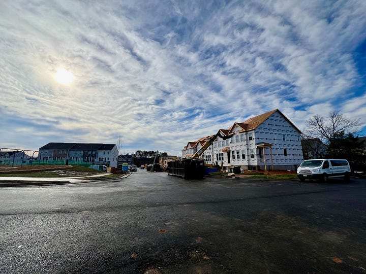 houses in a new neighborhood and a field before the new neighborhood was built