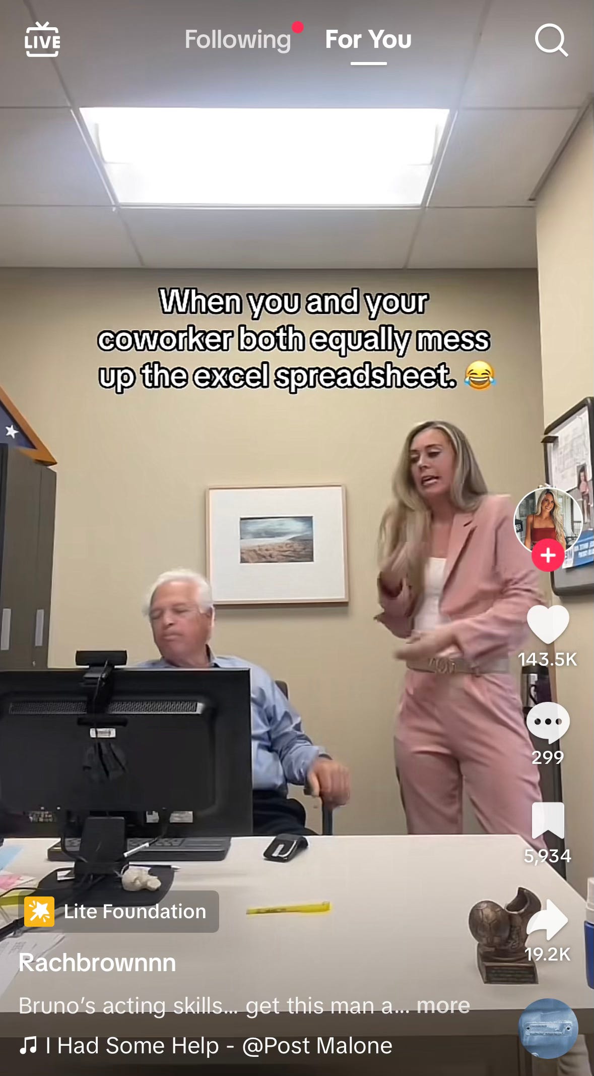 Screen capture of two coworkers staring at a computer