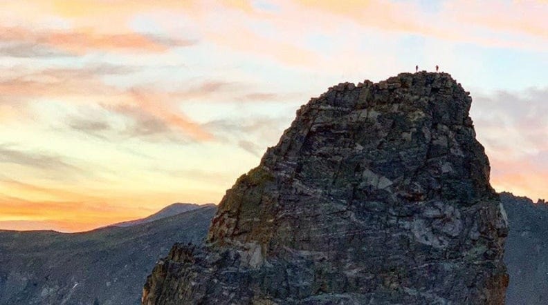 tommy caldwell and alex honnold standing on top of a huge mountain in colorado tommy caldwell and alex honnold standing on top of a huge mountain in colorado