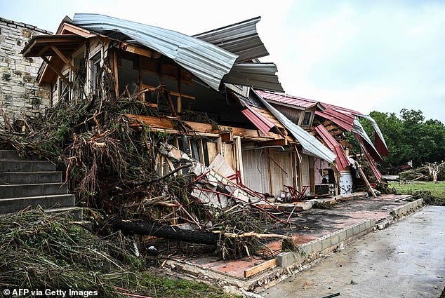 One of the huts at the camp was completely destroyed, with it's roof sagging over the structure