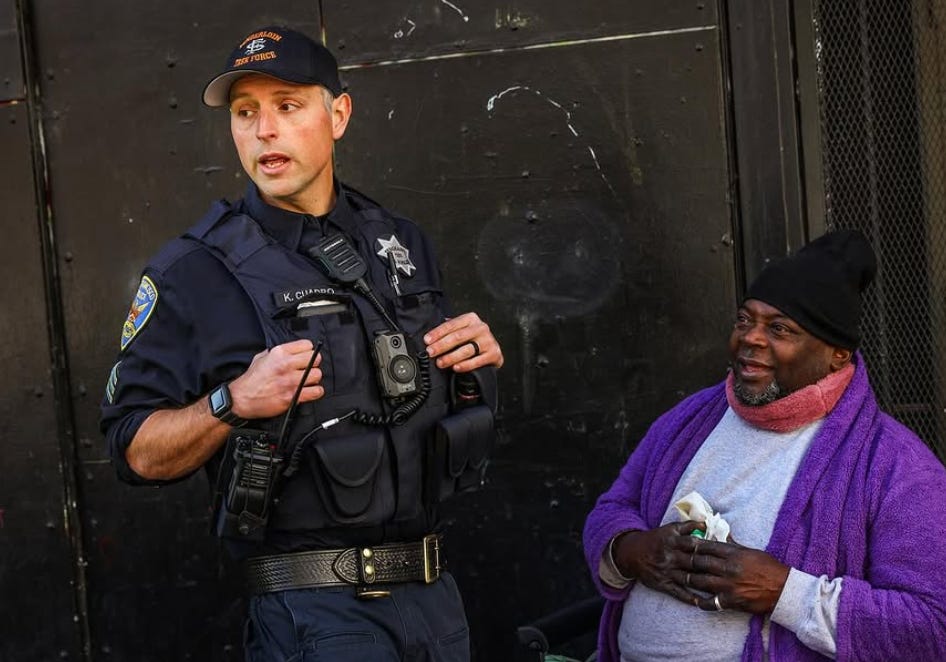 A police officer talking to a person

AI-generated content may be incorrect.